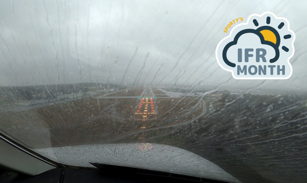 A rainy view from inside the cockpit