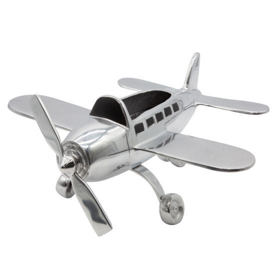 Front view of polished aluminum airplane organizer on white Front view of polished aluminum airplane organizer on white