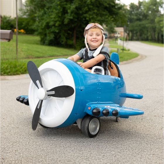 child riding in the flyer ride on 