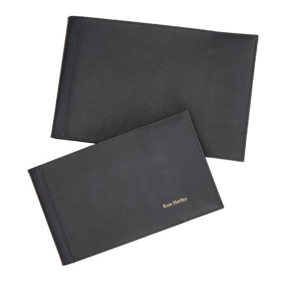 small and large logbook covers on white