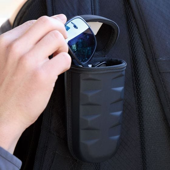 placing sunglasses into case placing sunglasses into case