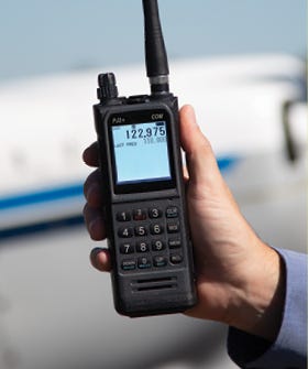 PJ2+ COM Radio displayed being help in the right hand