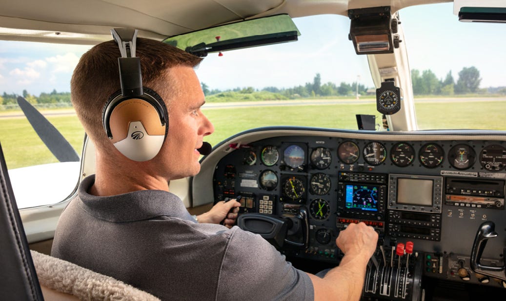 pilot sitting in plane wearing Lightspeed Delta Zulu headset