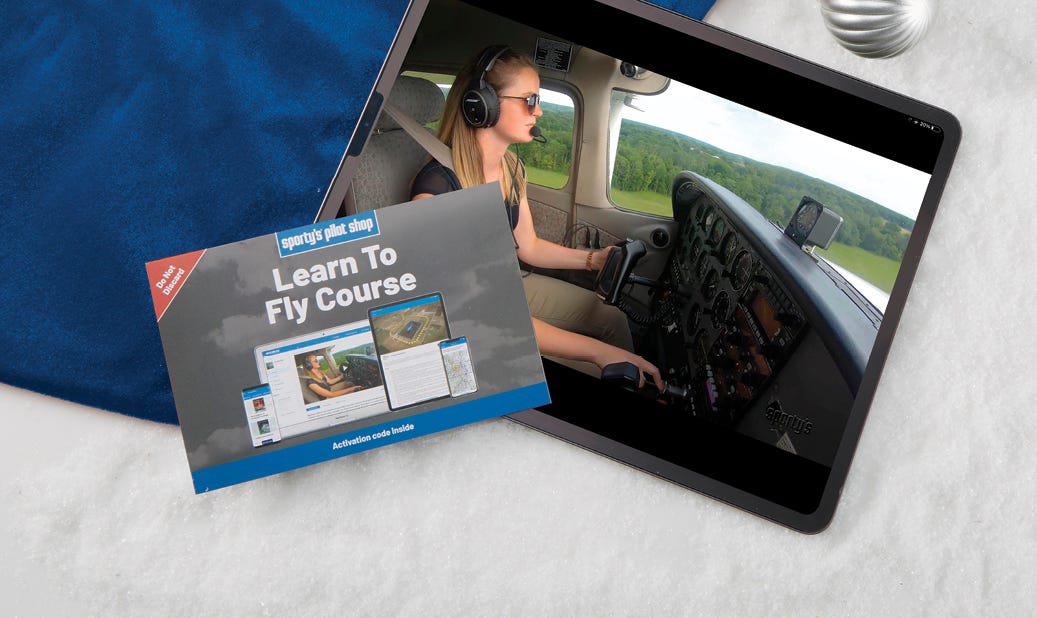 2024 learn to fly course displayed on tablet screen with gift decoration
