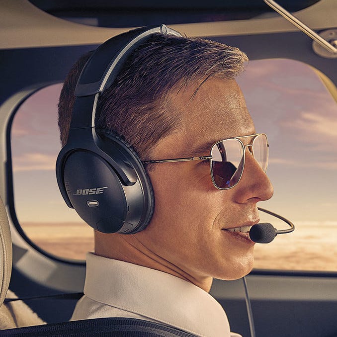 Pilot flying plane wearing Bose A30 aviation headset