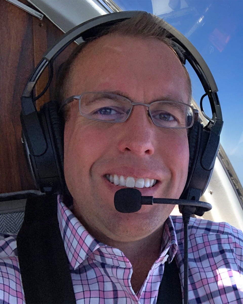 Bret Koebbe flying plane with Bose headset