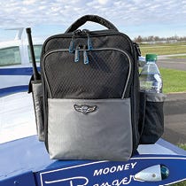 Flight Bag resting on wing of plane