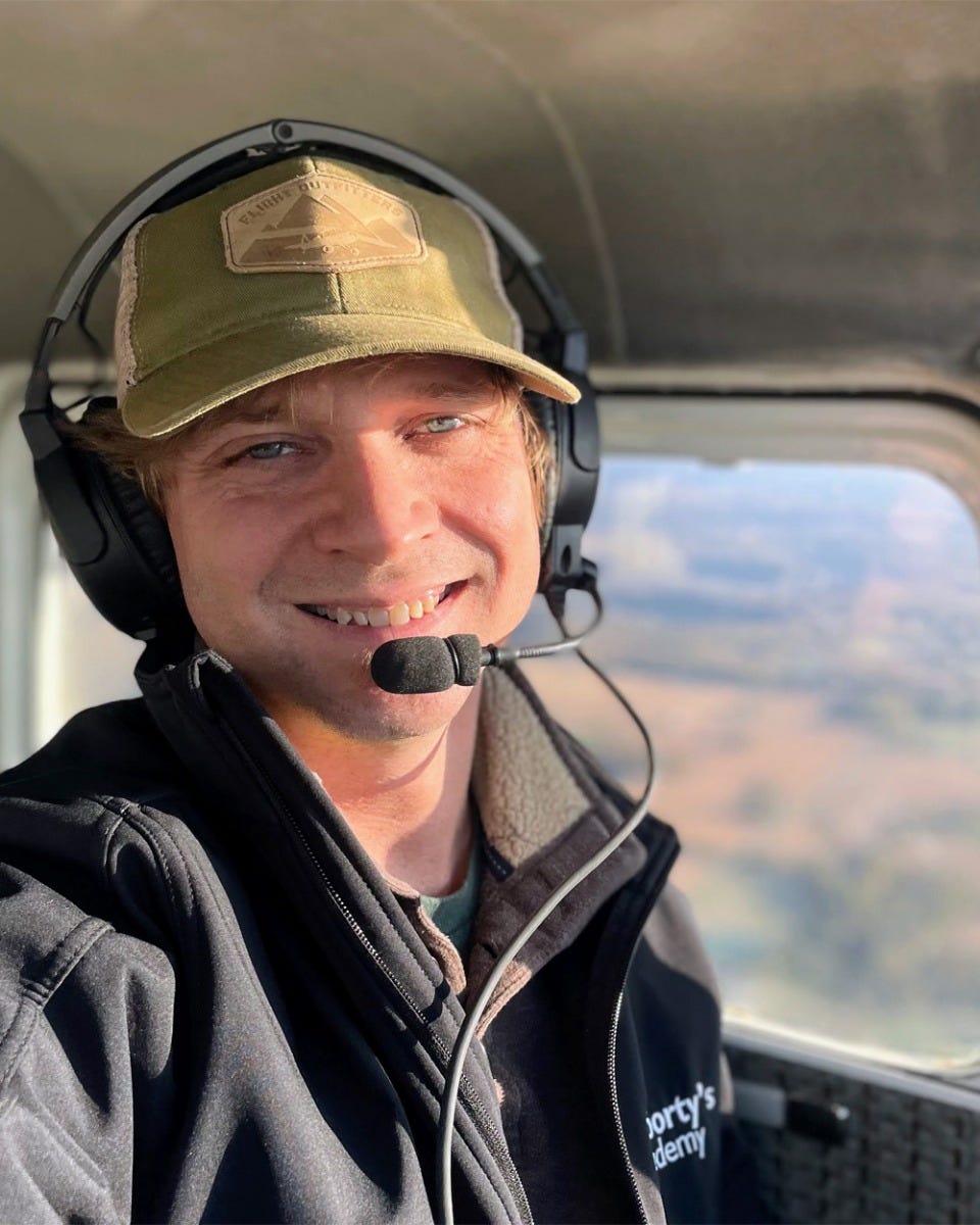 Chris Clarke flying plane with Lightspeed headset