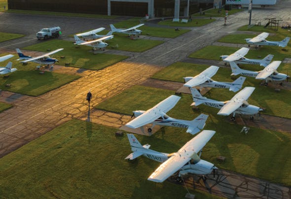Cessna planes parked outside of the Sportys building
