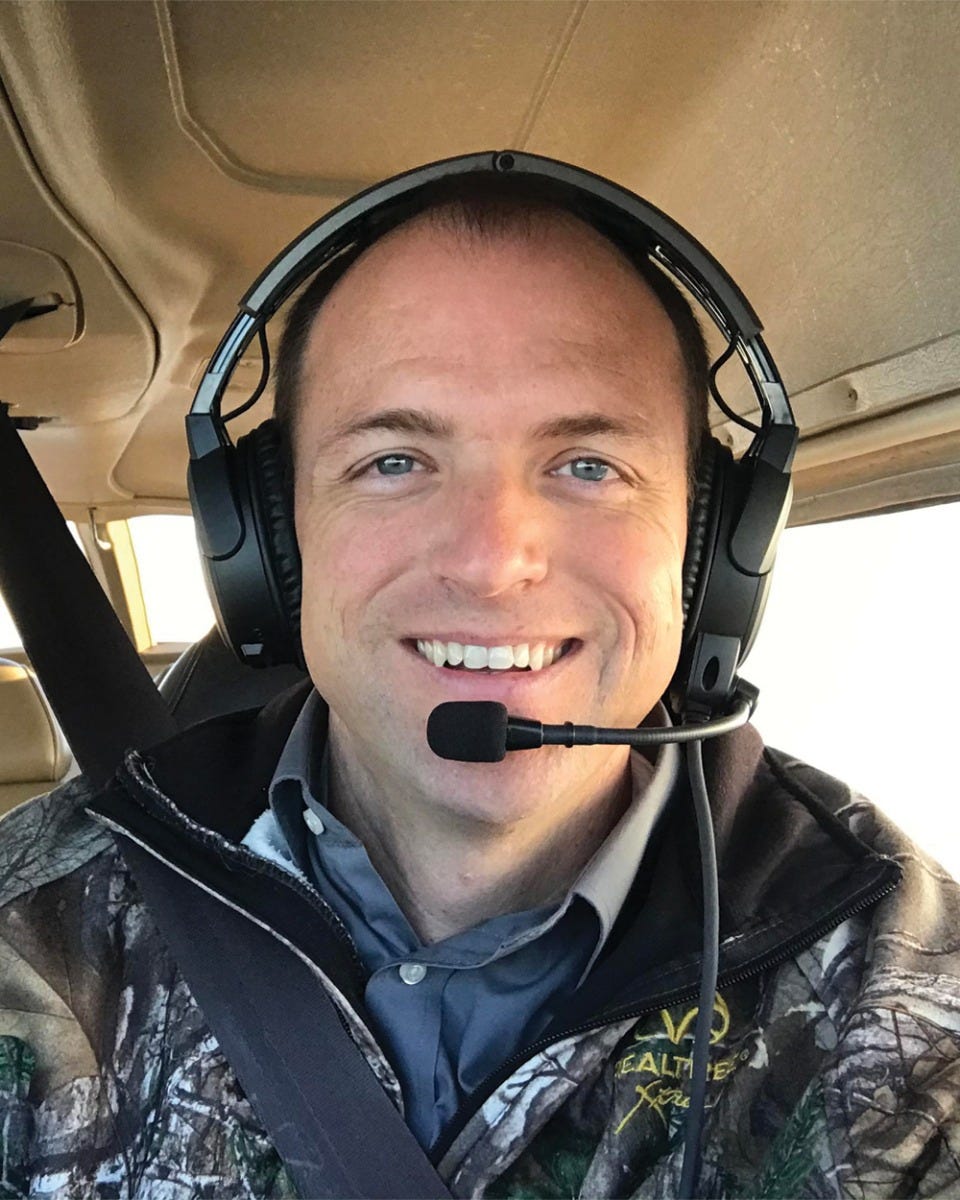 Doug Ranly flying plane with Bose headset