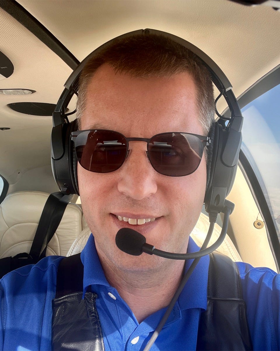 John Zimmerman flying plane with Bose headset