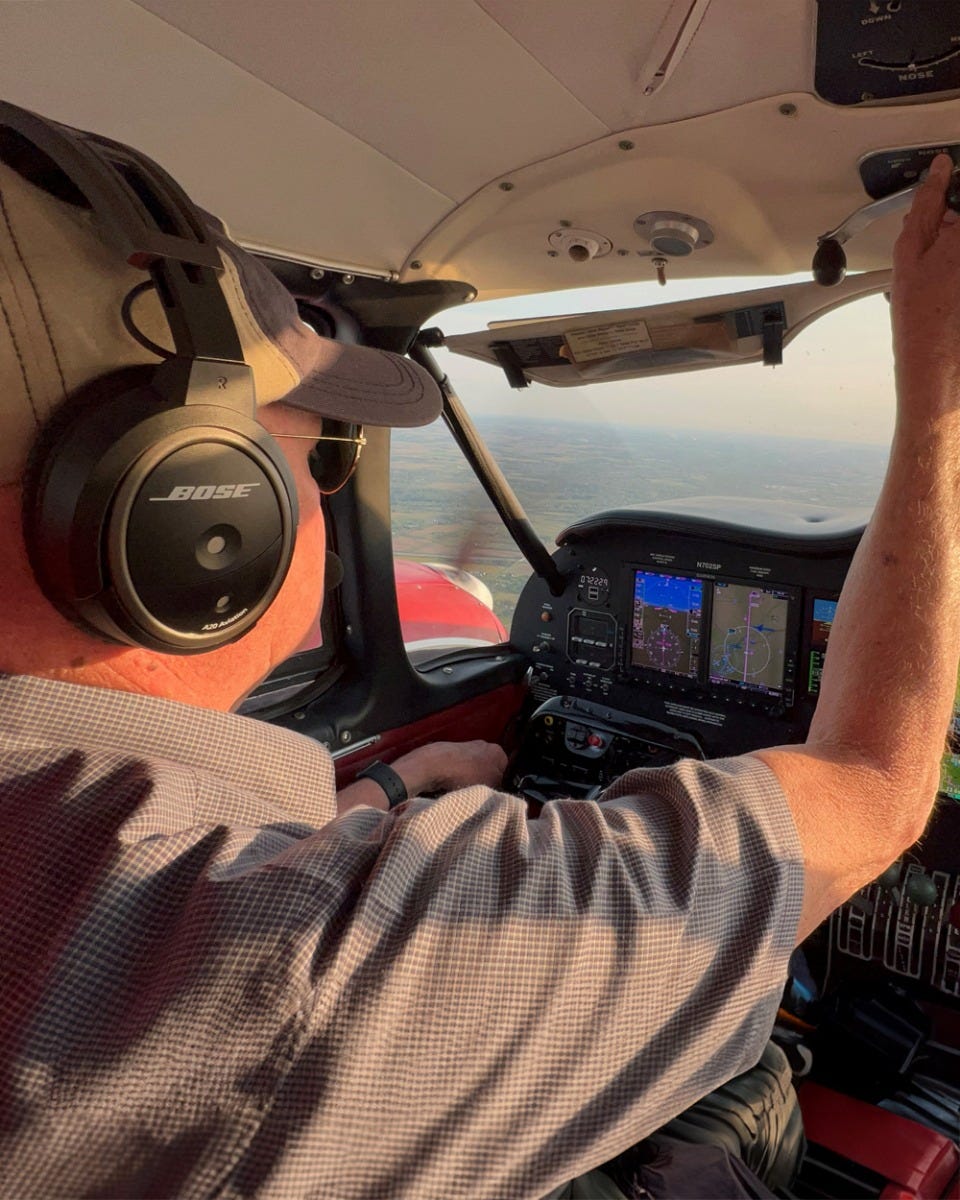 Michael Wolf flying plane with Bose headset