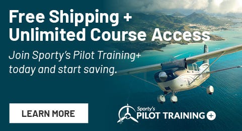 Plane flying over shoreline