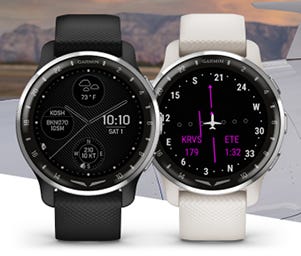 Garmin Watches displayed in front of a mountain range
