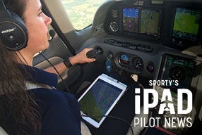 pilot using ipad while flying plane