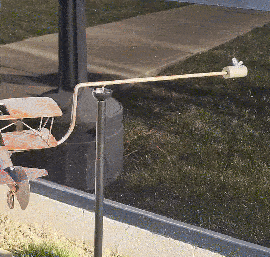 Solar Biplane Wind Balancer spinning in yard