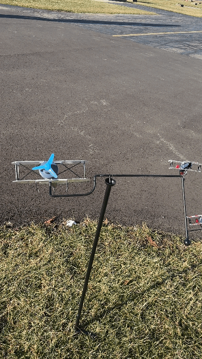 Solar Dueling Biplane Wind Balancer spinning in yard