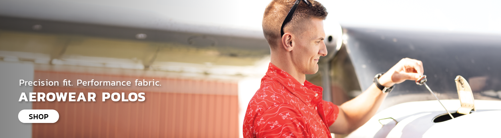 Man wearing a red Aerowear polo