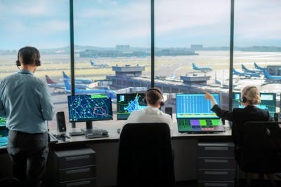 Aerial view of a busy towered airport with multiple runways
