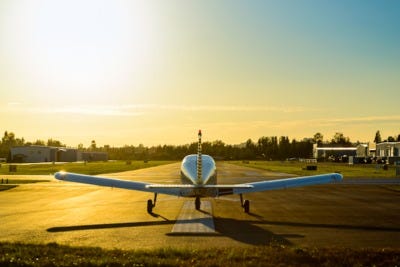 A small airplane climbing just after takeoff